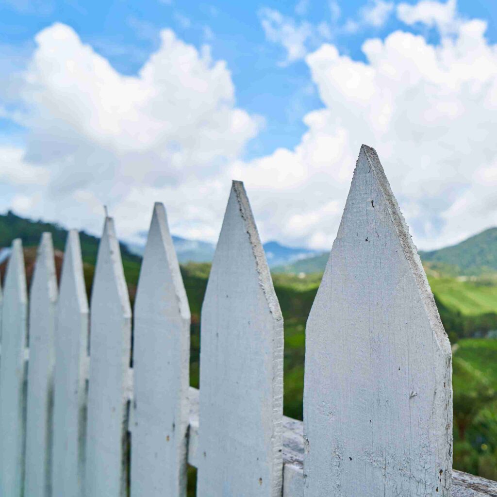 close up white wooden fence scaled