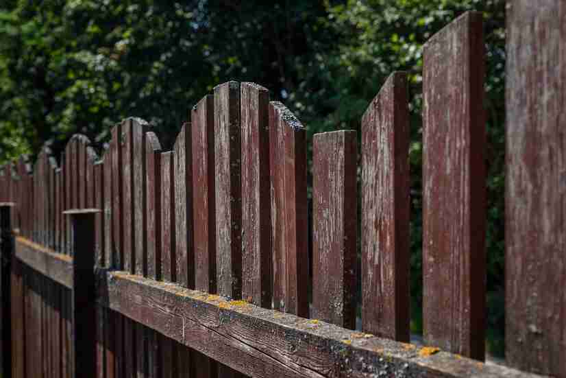 old-brown-wooden-fence-side-view-close-up